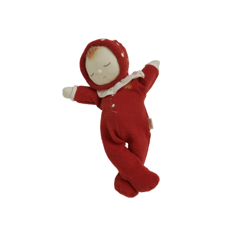 Small red plush baby doll with a white hood on a white background
