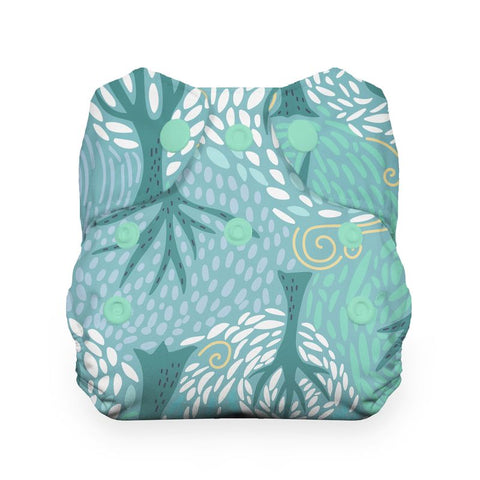 Green and blue patterned cloth diaper on a white background