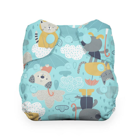 Patterned diaper cover with cartoon animals on a blue background