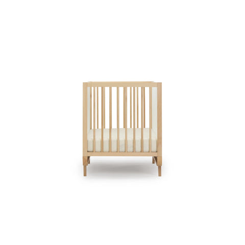 jolly crib by dadada in natural and white with curved features, made in italy, beautiful nursery furniture