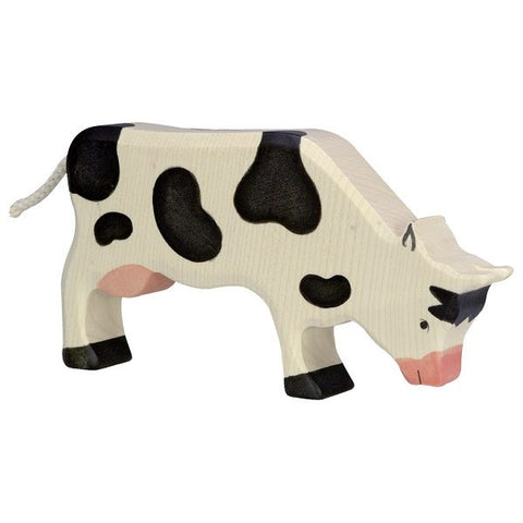 holztiger grazing cow