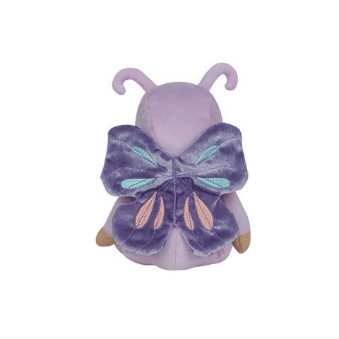 Small plush toy with purple butterfly wings on a white background