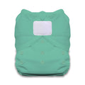 Green cloth diaper with a white patch on a white background