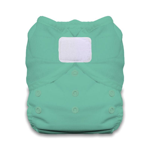 Green cloth diaper with a white patch on a white background